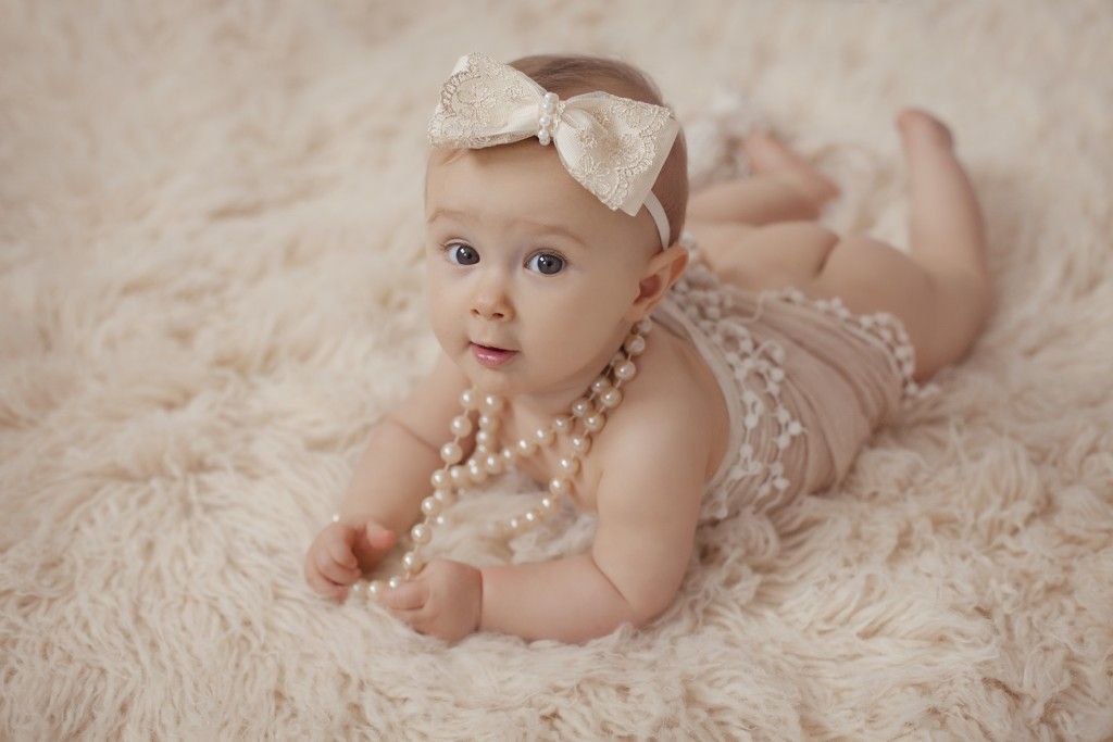 IVORY SATIN AND GOLD LACE BOW DECORATED WITH STUNNING PEARL TRIM ON A SOFT ELASTIC HEADBAND